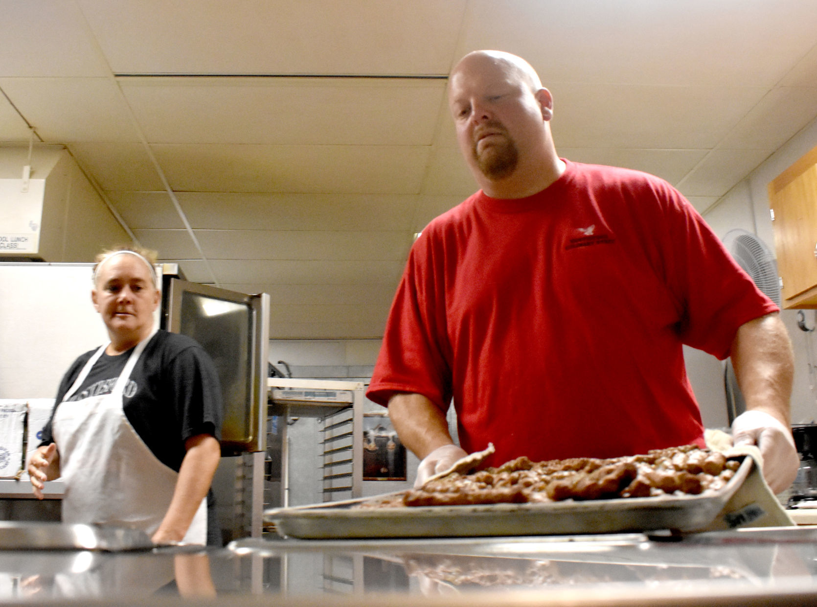 Jason White prepares school lunch in Hustisford